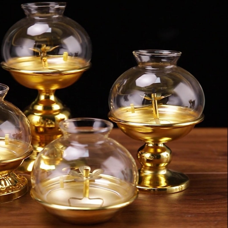Lampada a olio dorata per Budd - Candle Zero recensione e prezzo